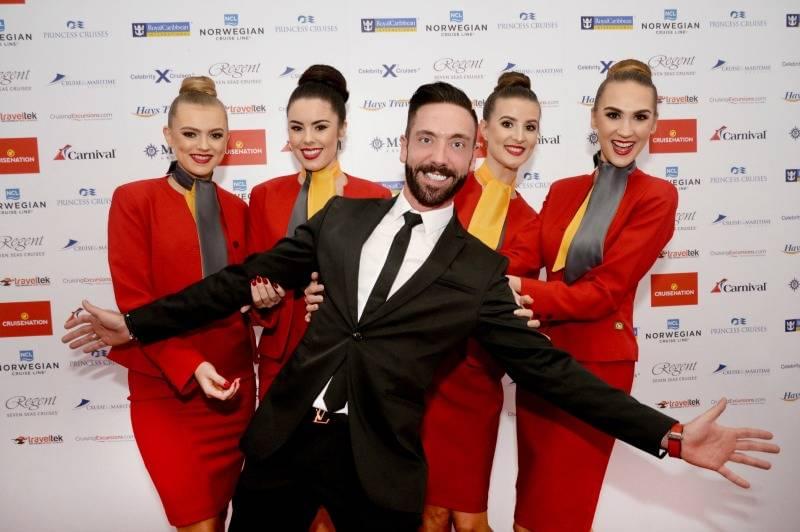 Cruise Nation founder Phil Evans with models wearing new uniform