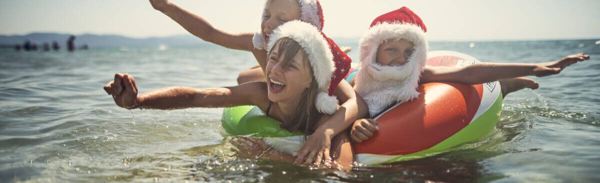 Kids playing in sea at Christmas
