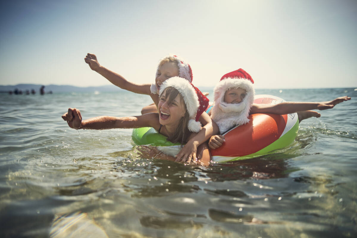 Kids playing in sea at Christmas