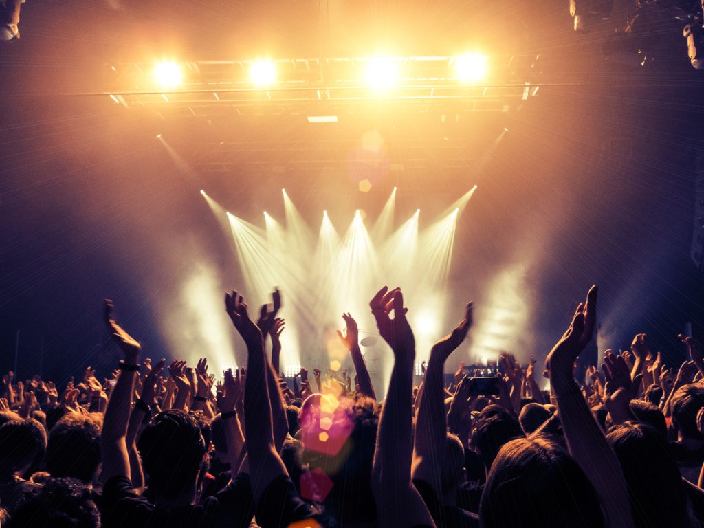 Crowd point of view inside a concert hall.