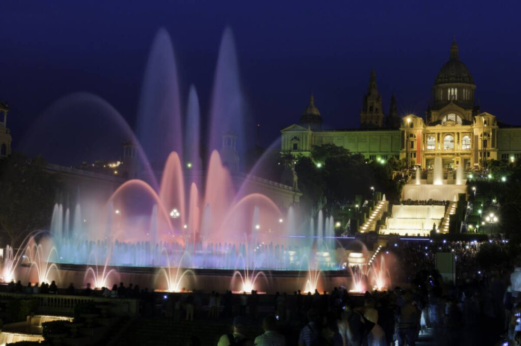 Barcelona Font Màgica MNAC tourists watching colorful fountain night Spain